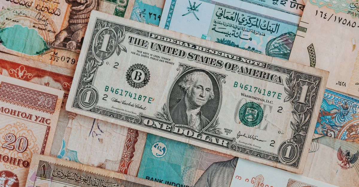 Top view of assorted paper money with American greenback representing image of President and numbers with words and signature on bill